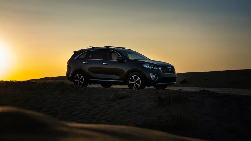 Black BMW X series on desert during sunset