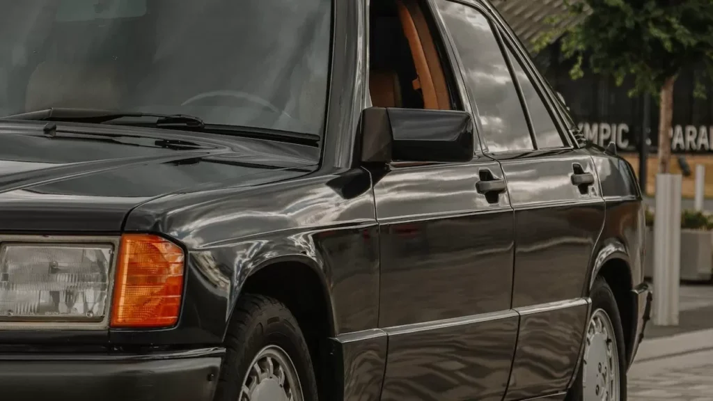 A vintage black Mercedes Benz sedan elegantly parked outdoors