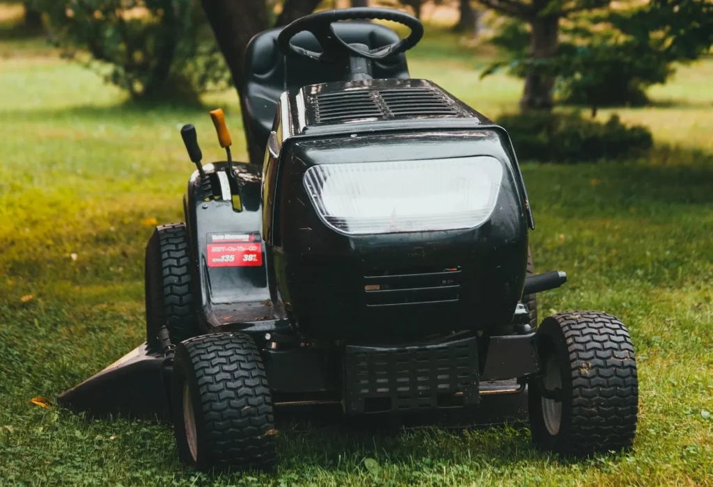 Black ride on toy car on green grass field during daytime