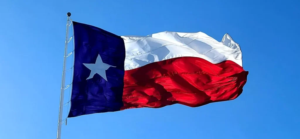 The Texas flag on a clear, windy day