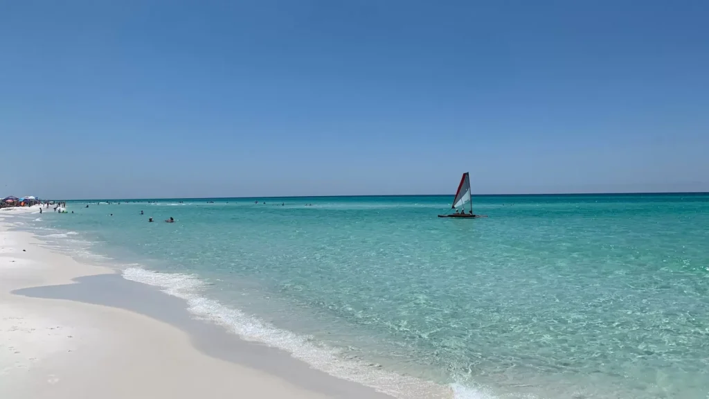 sailboat on sea under blue sky during daytime