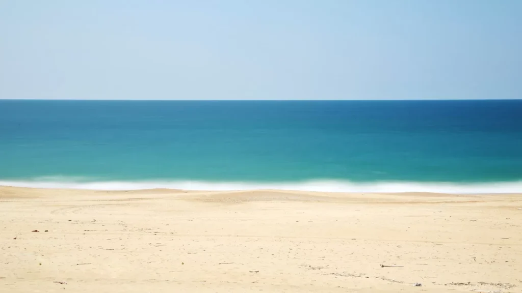 sandy beach with turquoise ocean