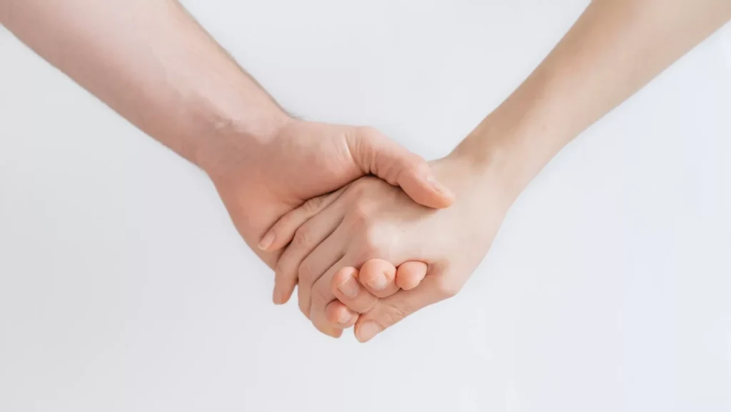 woman and man holding hands