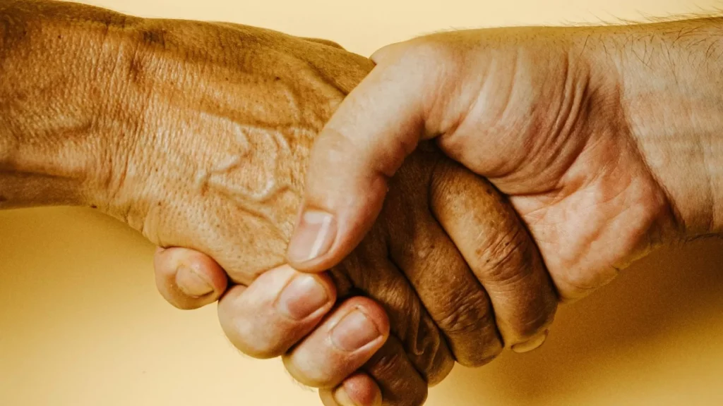 Two person holding hands