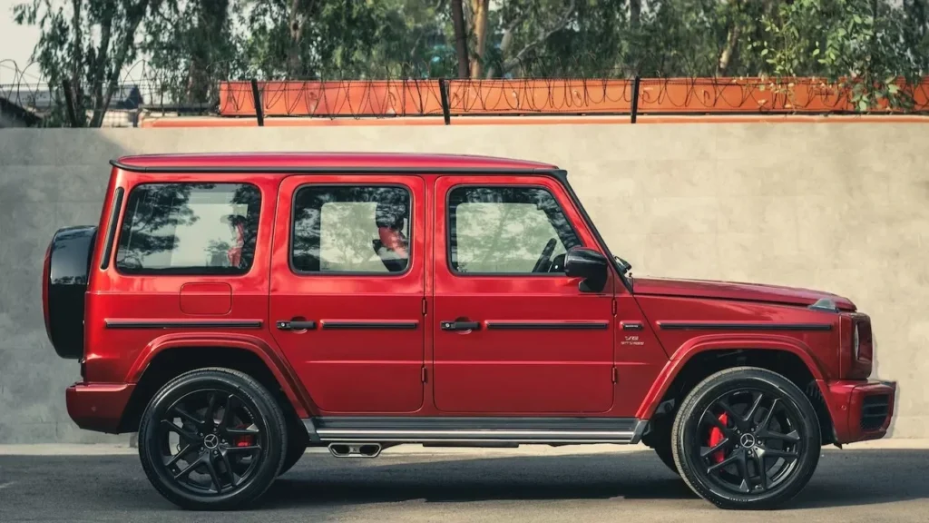 Stylish red Mercedes-Benz G Class SUV parked outdoors