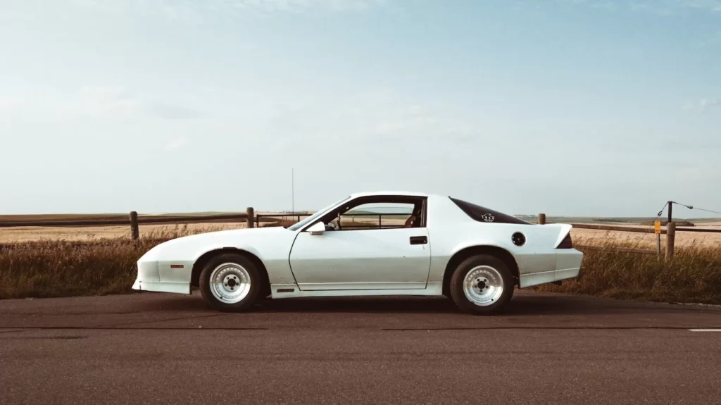 Silver Camaro 1988 under cloudy sky