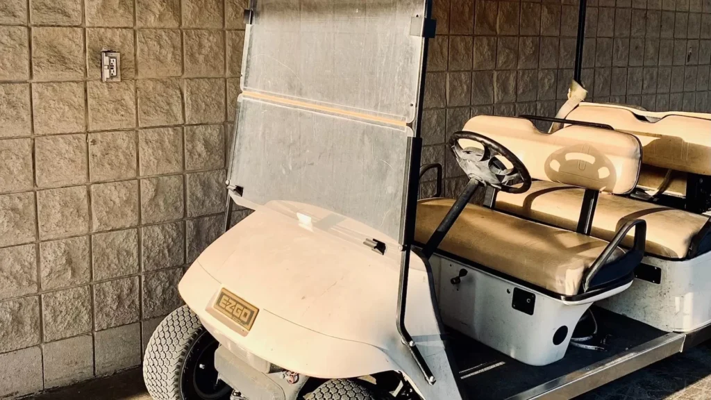 White and brown golf cart
