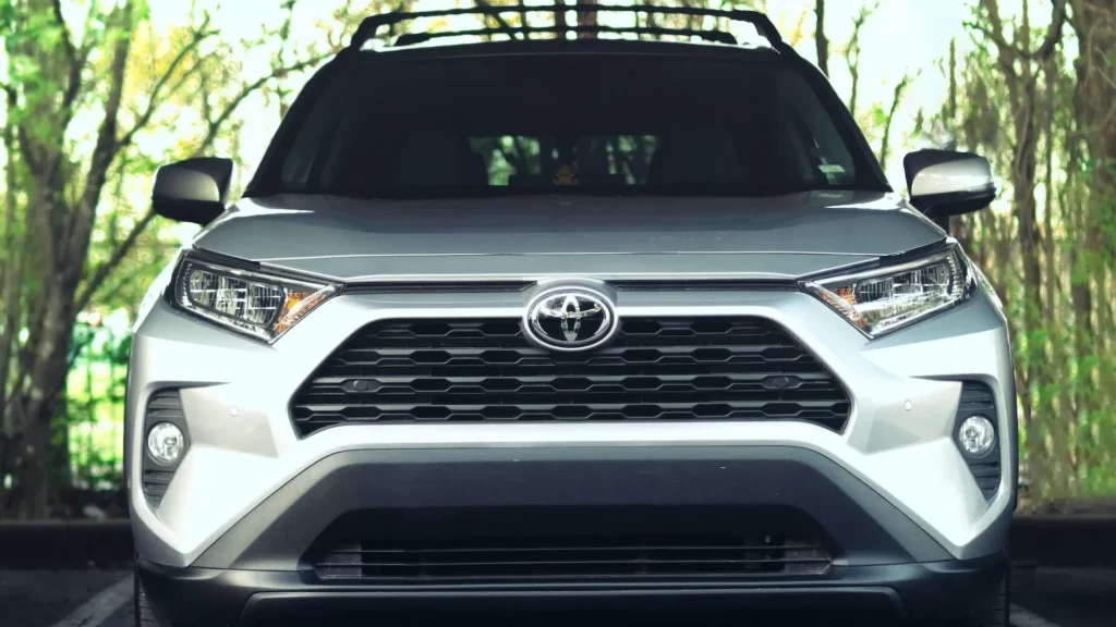 White RAV4 on road during daytime