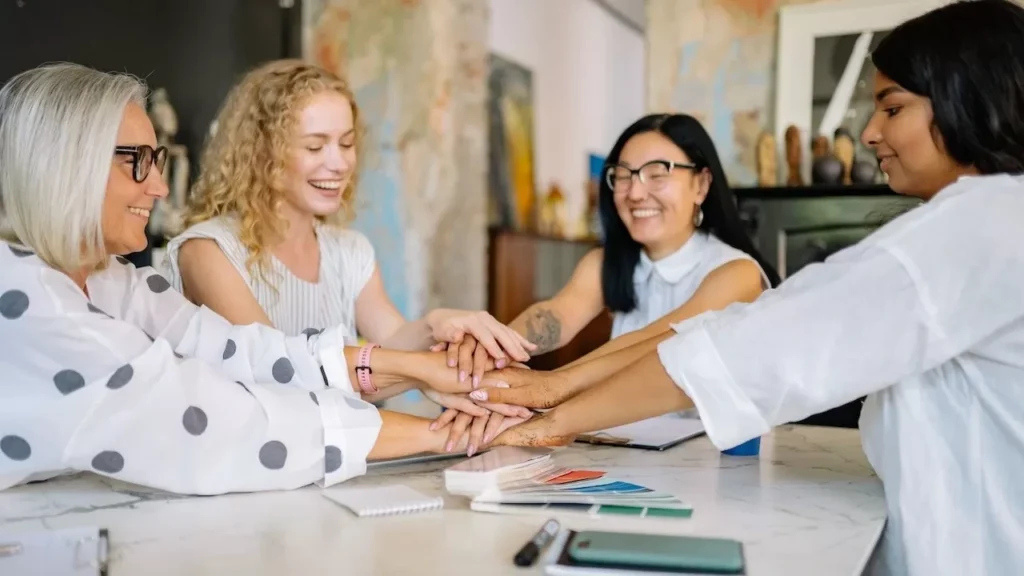 Diverse group of businesswomen collaborating at a desk