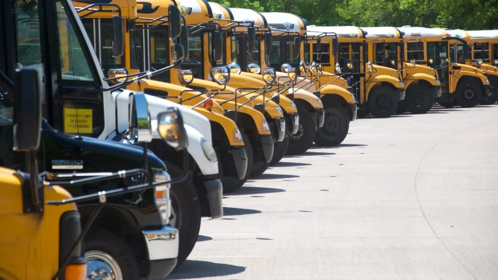 Yellow school bus on road during daytime